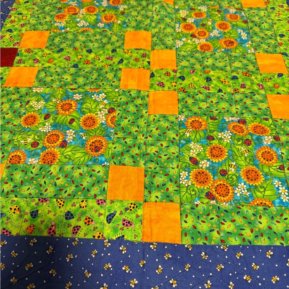 Quilt with Green and Orange Accents